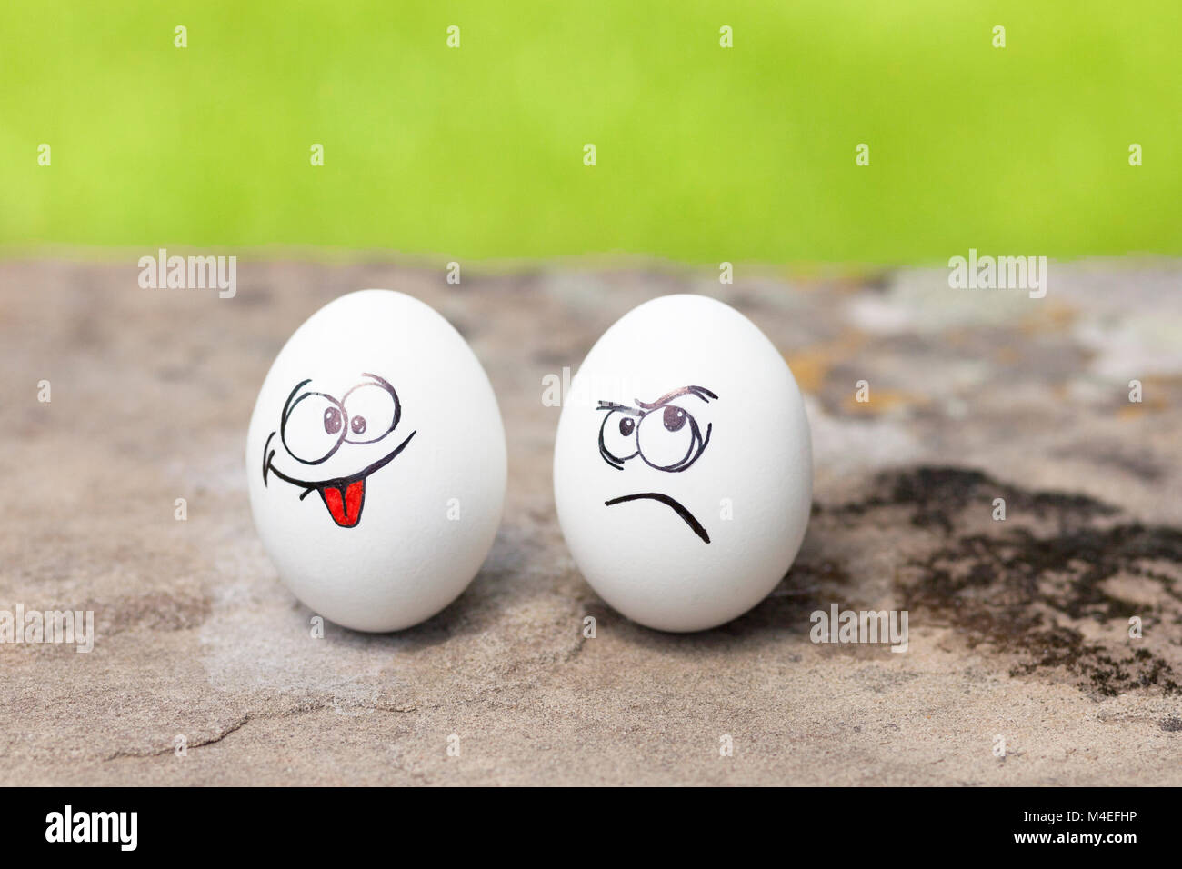 Angry and mischievous faces drawn on eggs Stock Photo