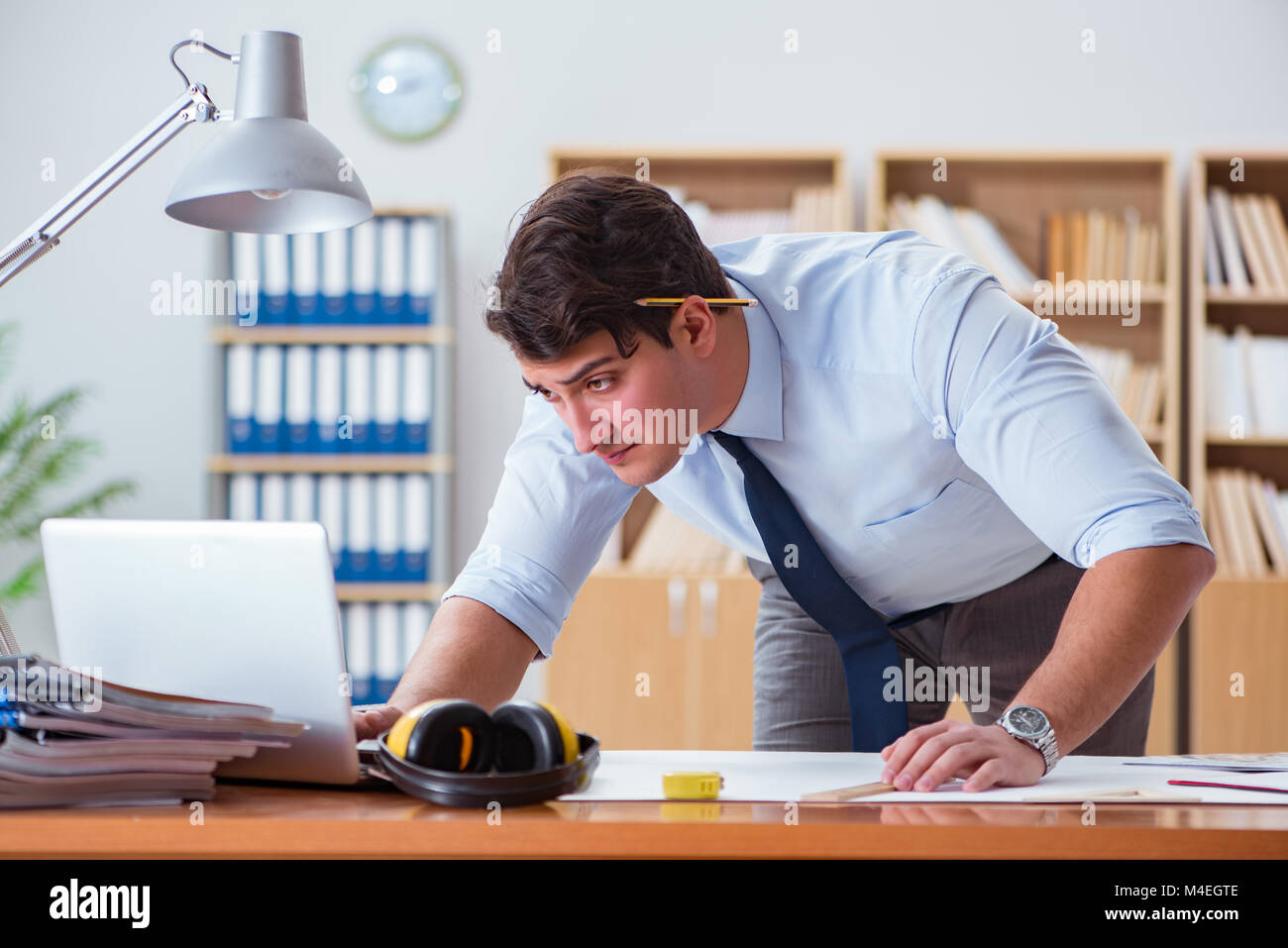 Engineer supervisor working on drawings in the office Stock Photo Alamy