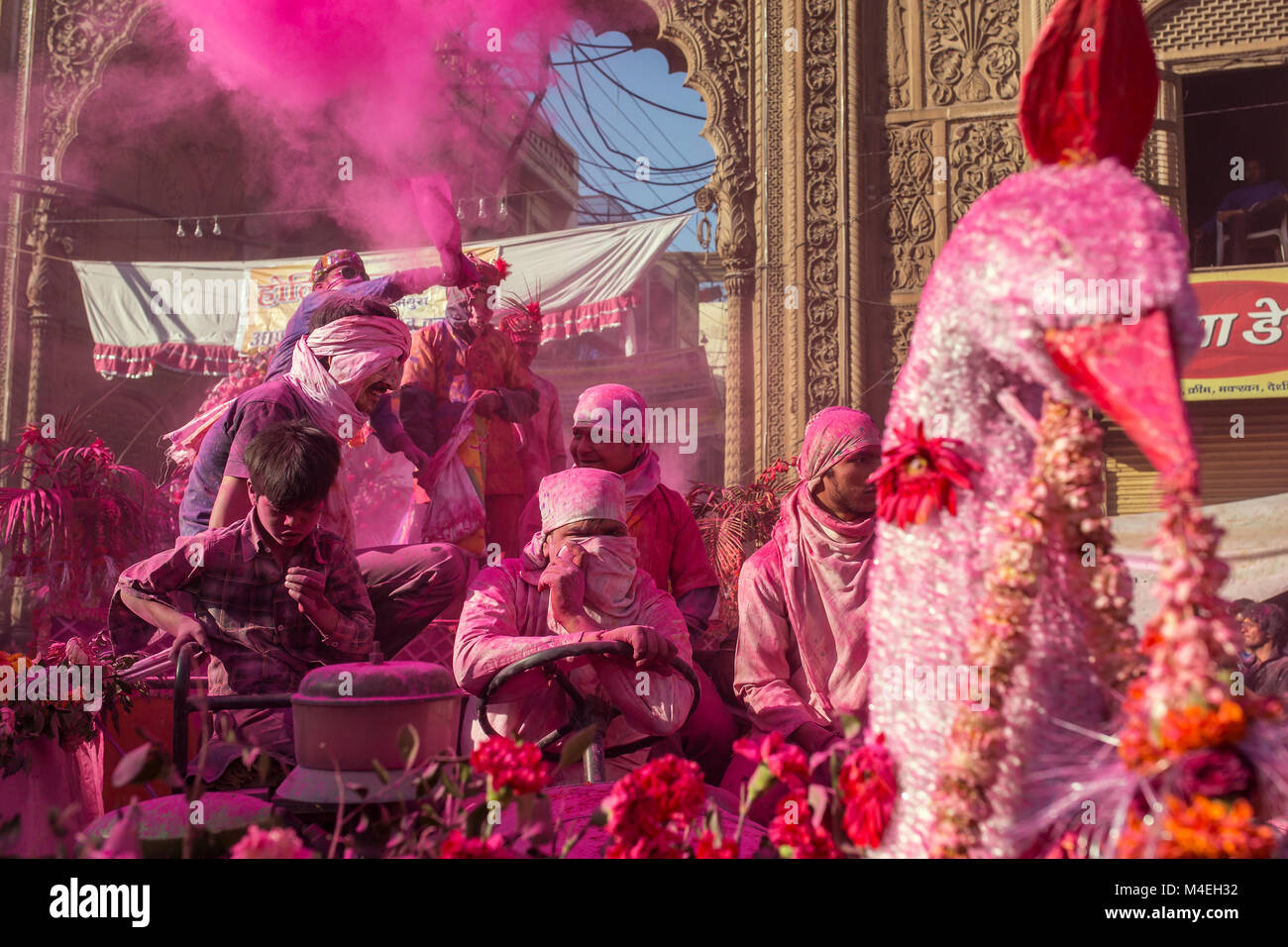 Mathura, India - March 23, 2016: Colourful Holi procession on the streets of Mathura, Uttar Pradesh, India. Stock Photo