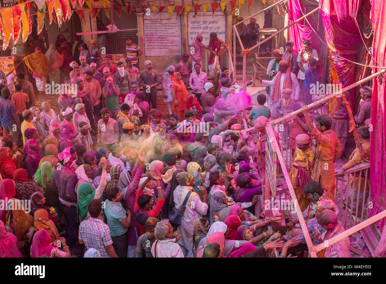 Barsana, India - March 17, 2016: Hindu devotees celebrate Lathmar Holi in Barsana village, Uttar Pradesh, India. Stock Photo