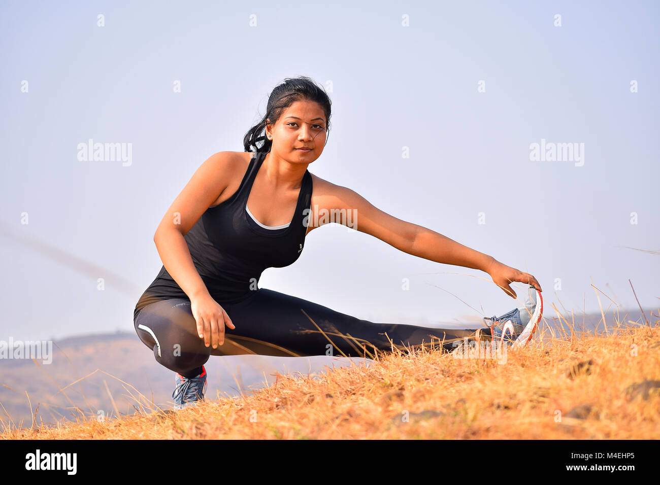 Beginner girl exercising in fitness Stock Photo - Alamy