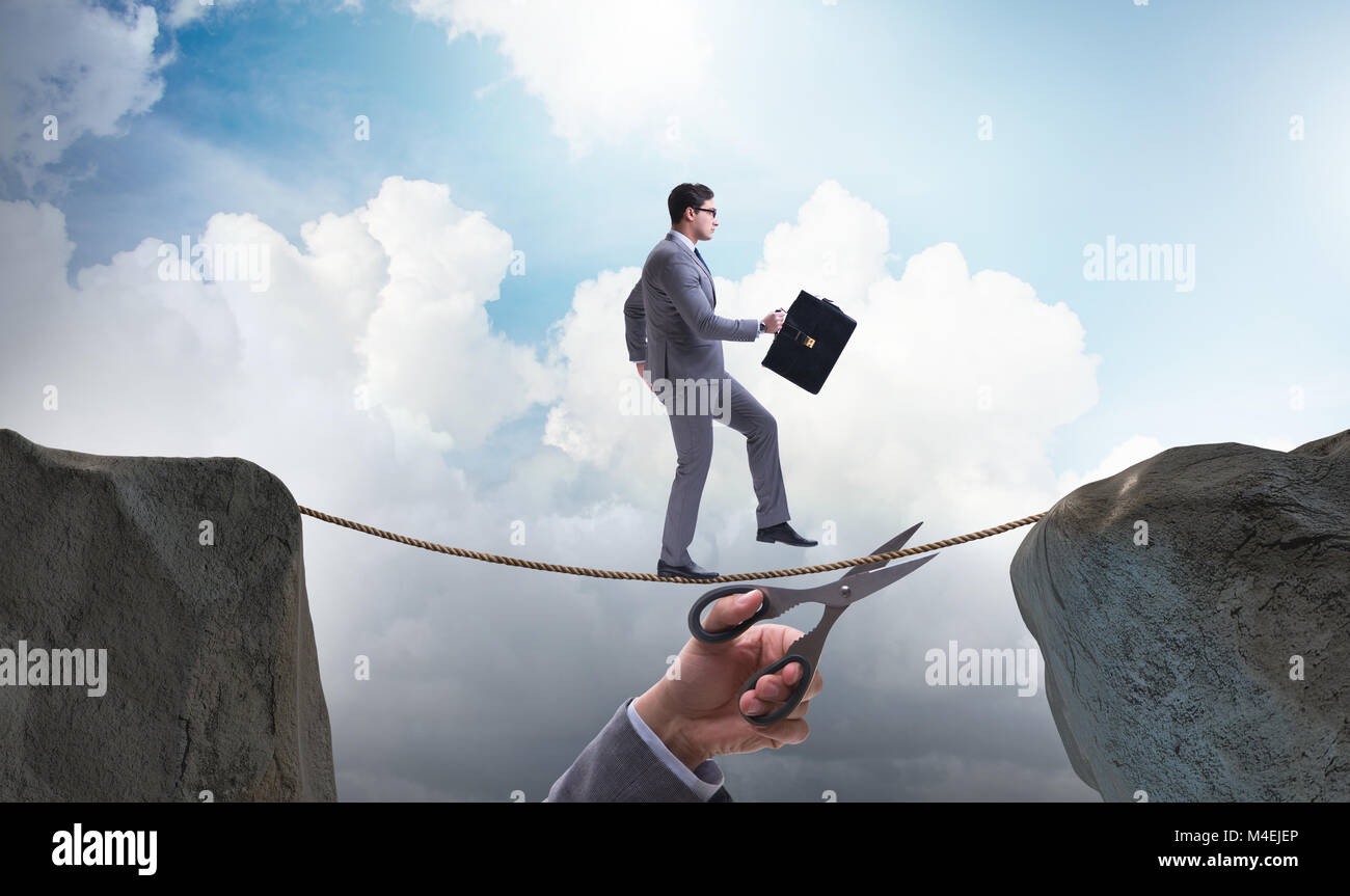 Hand cutting the rope under businessman tightrope walker Stock Photo ...