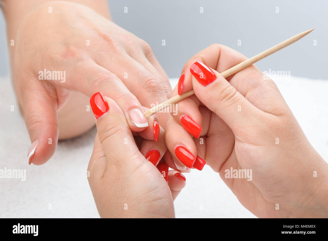 Cuticles care with cuticle pusher Stock Photo