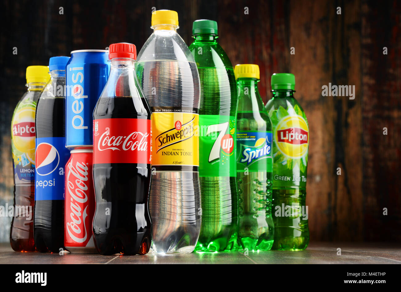 Bottles and cans of assorted global soft drinks Stock Photo Alamy