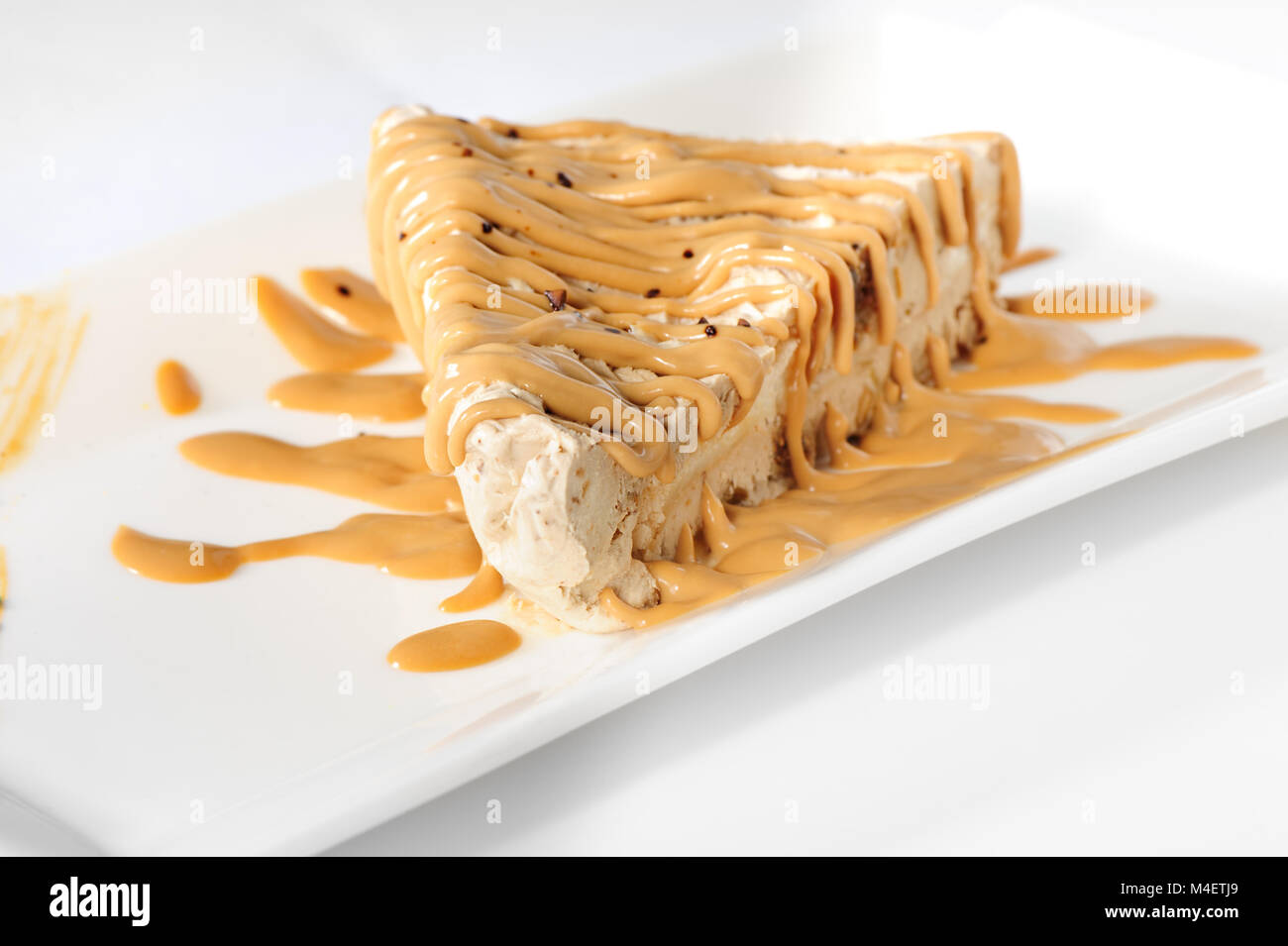 Delicious cheesecake with caramel topping Stock Photo