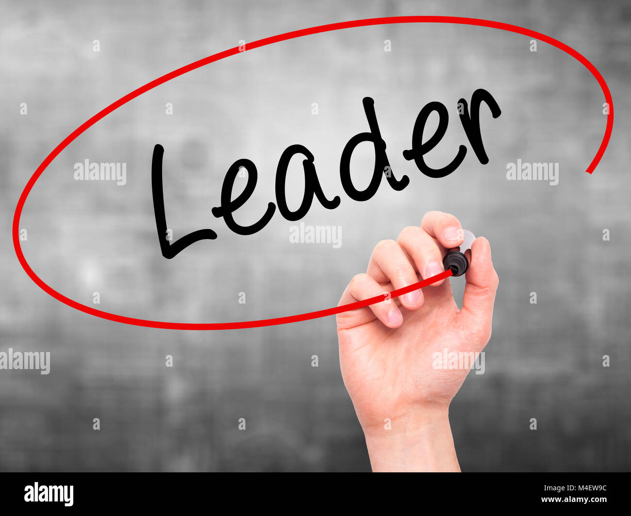 Man Hand writing Leader with black marker on visual screen Stock Photo ...