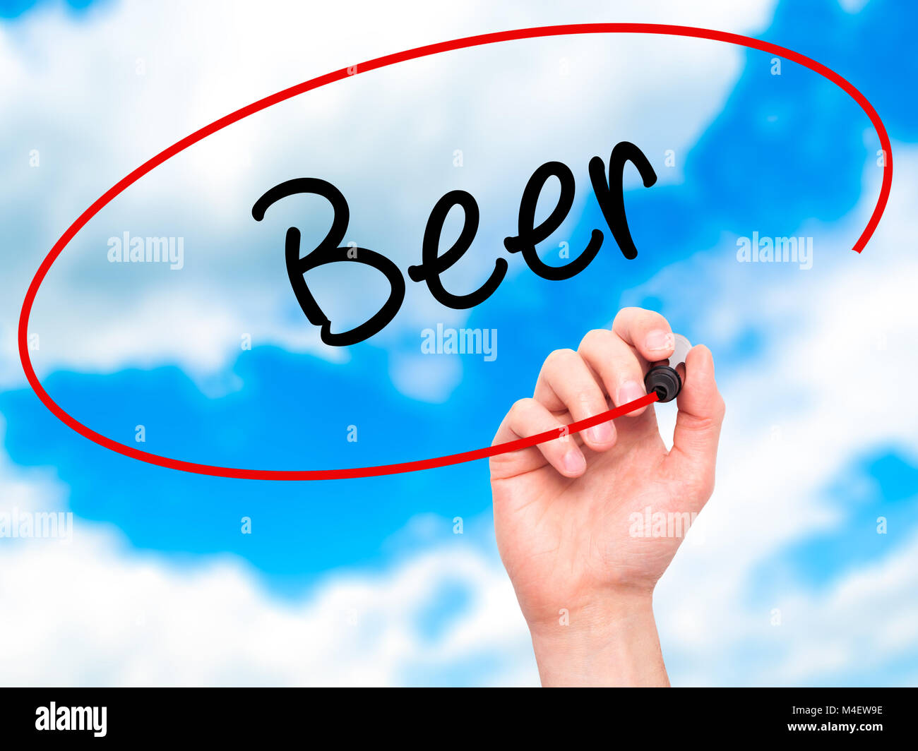 Man Hand writing Beer with black marker on visual screen Stock Photo