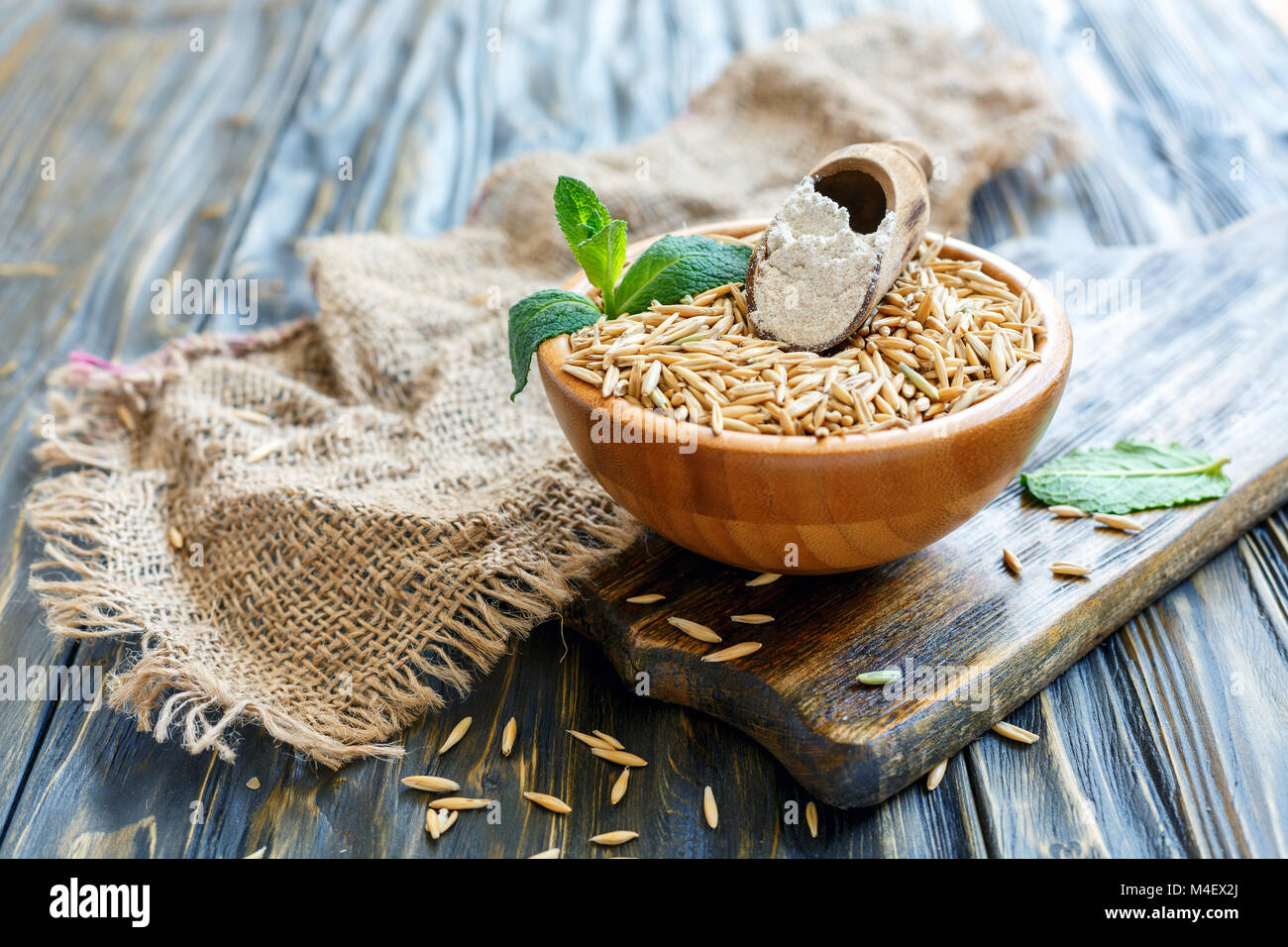 Scoop with oat flour in a bowl with whole oats Stock Photo Alamy