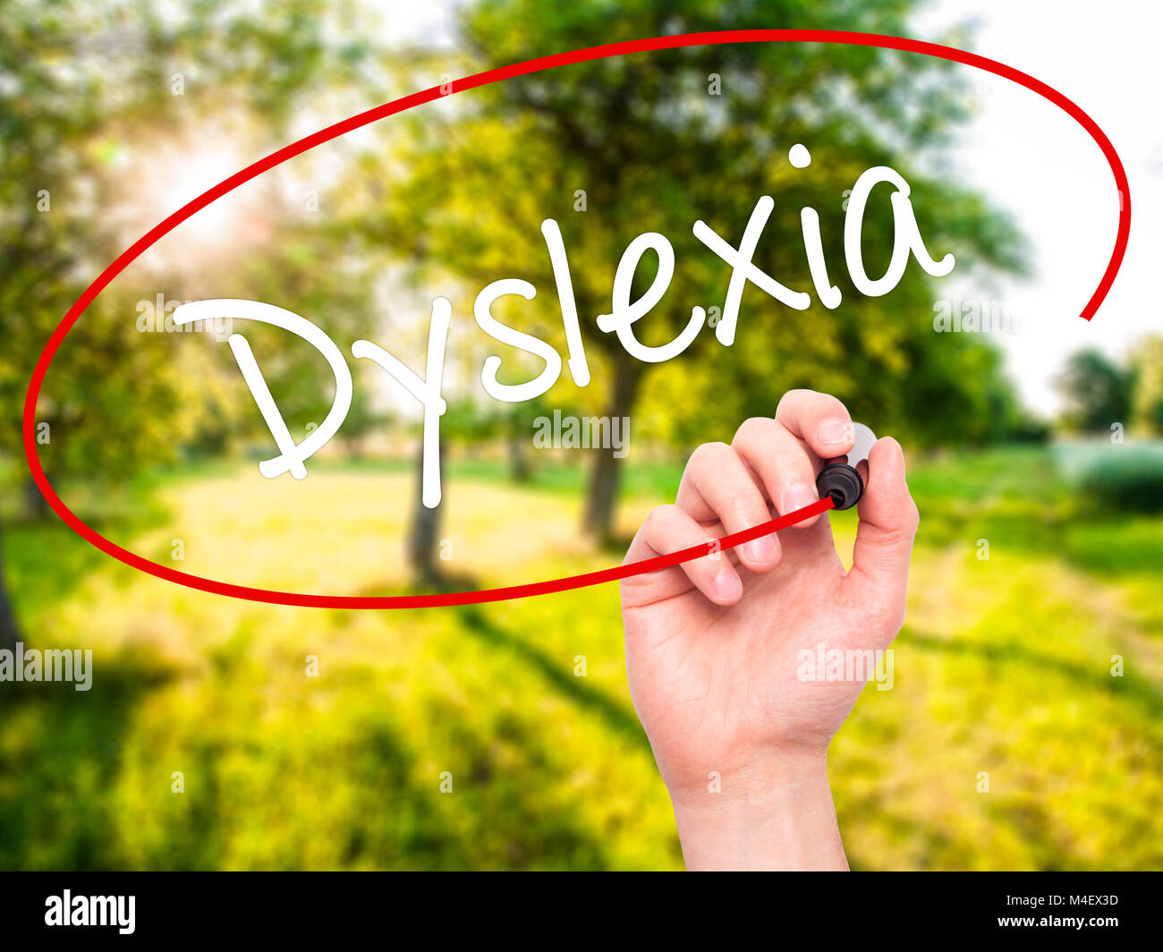 Man Hand writing Dyslexia with black marker on visual screen Stock Photo