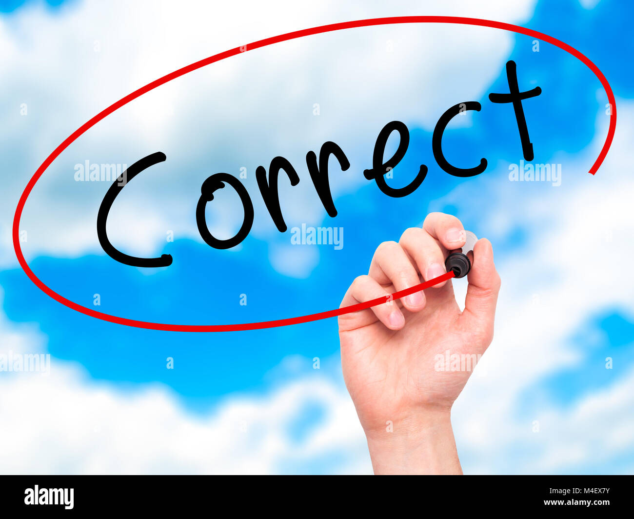 Man Hand writing Correct with black marker on visual screen Stock Photo
