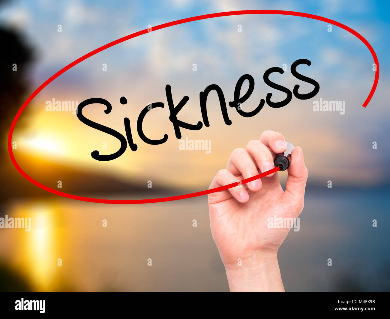 Man Hand writing Sickness with black marker on visual screen Stock Photo