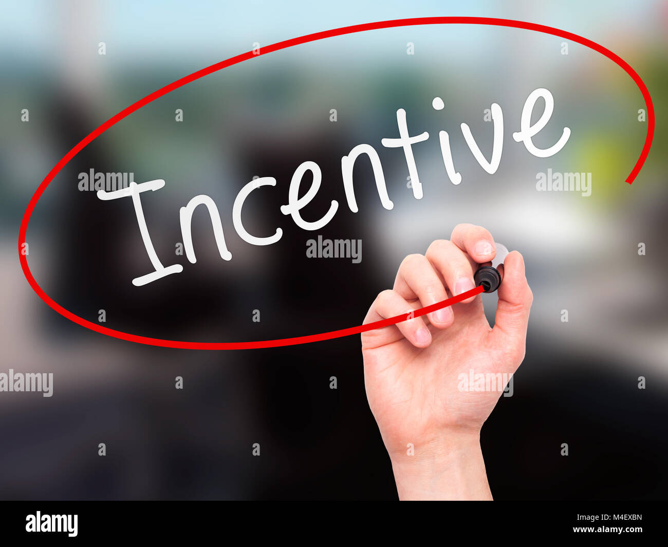 Man Hand writing Incentive with marker on transparent wipe board Stock Photo