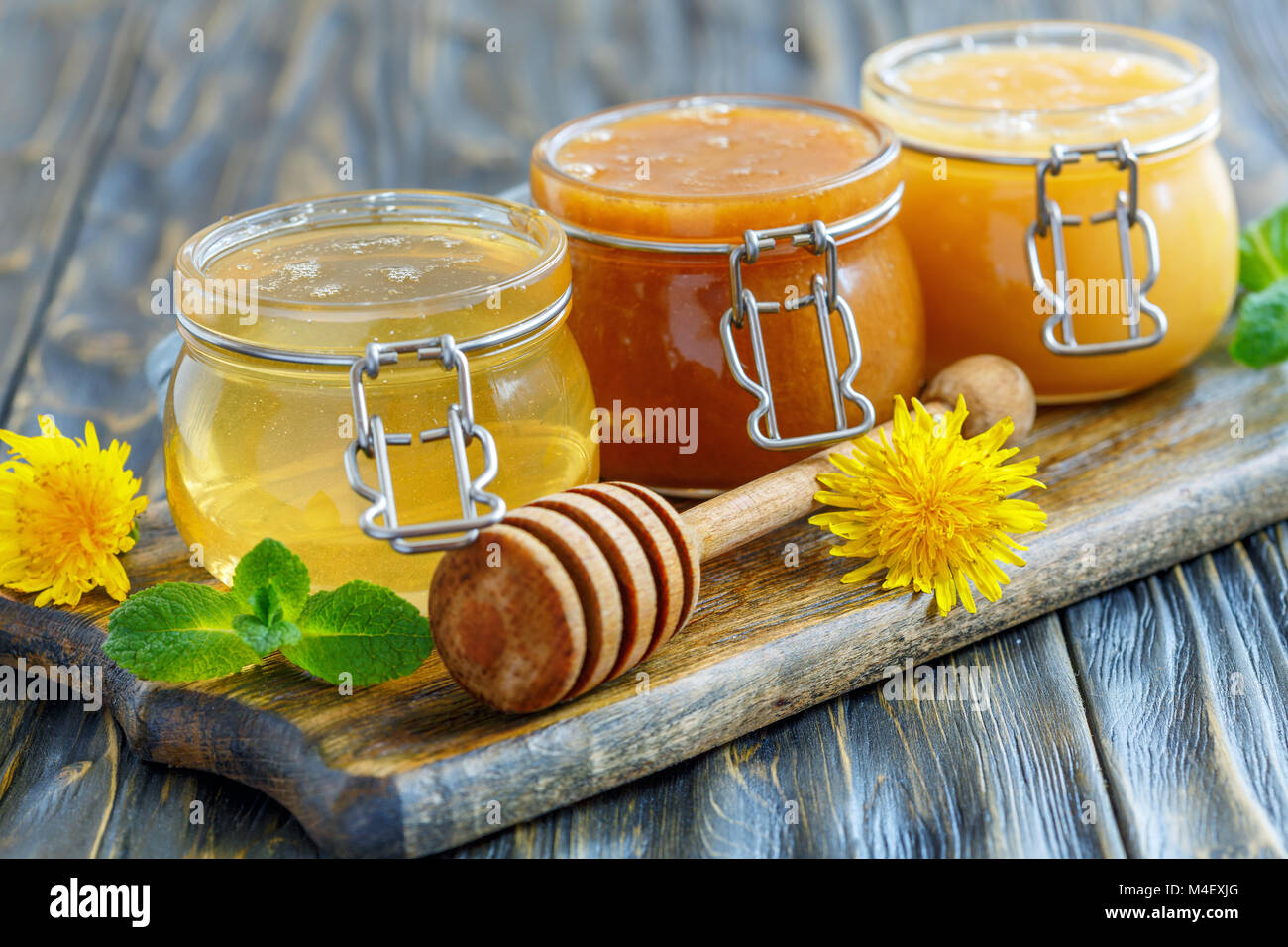 Natural honey in glass jars Stock Photo Alamy