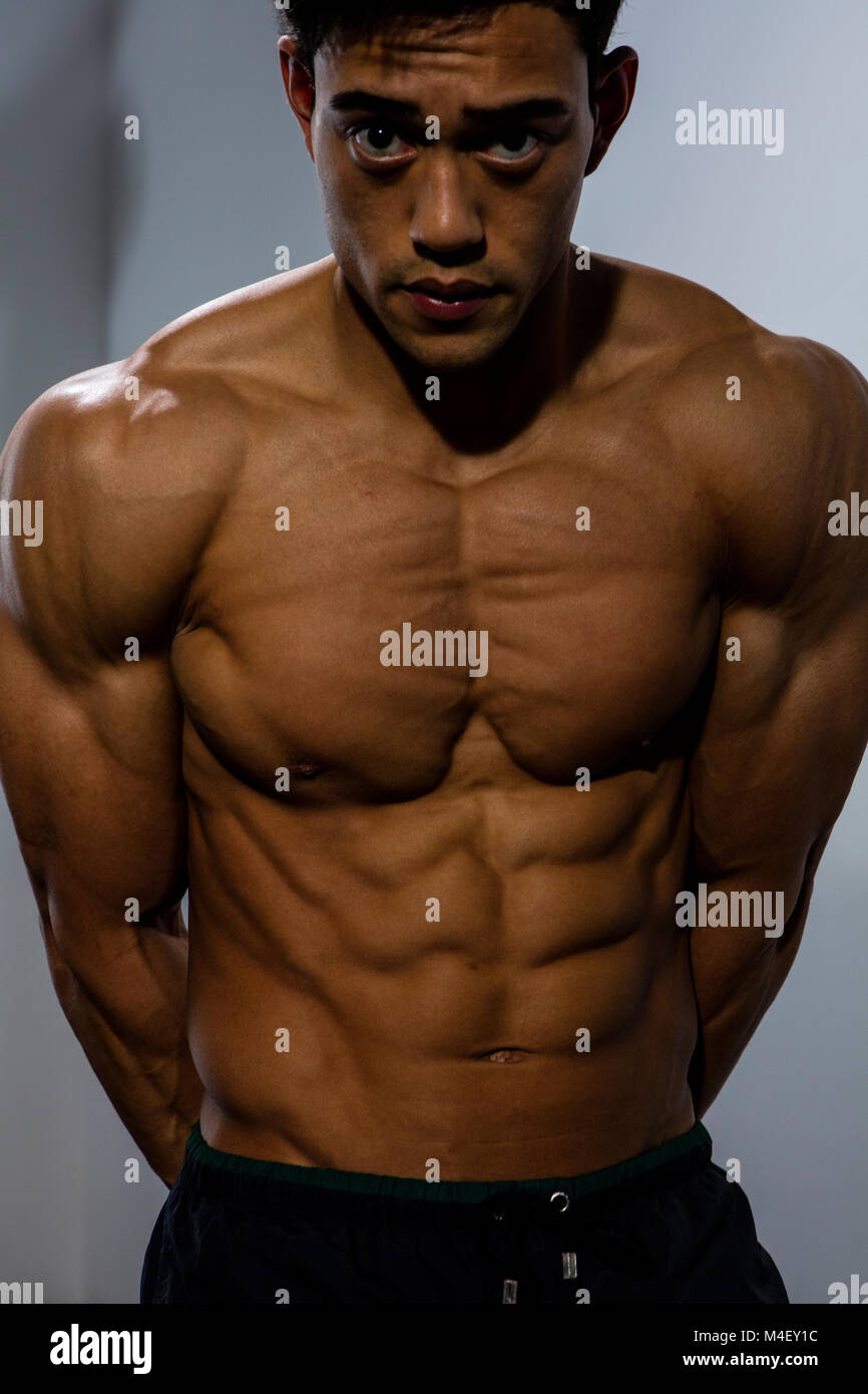 A fitness model torso with the chest muscles tightly flexed. Close up shot  Stock Photo - Alamy