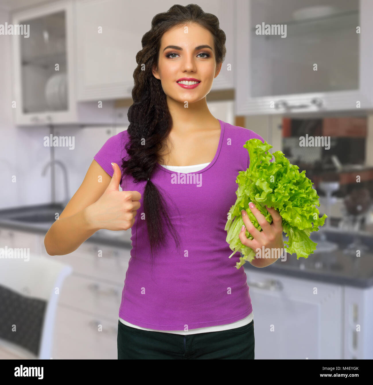 Young cooking woman at kitchen Stock Photo