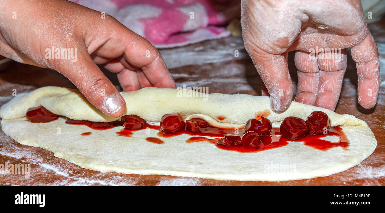 The hands of the confectioner Stock Photo