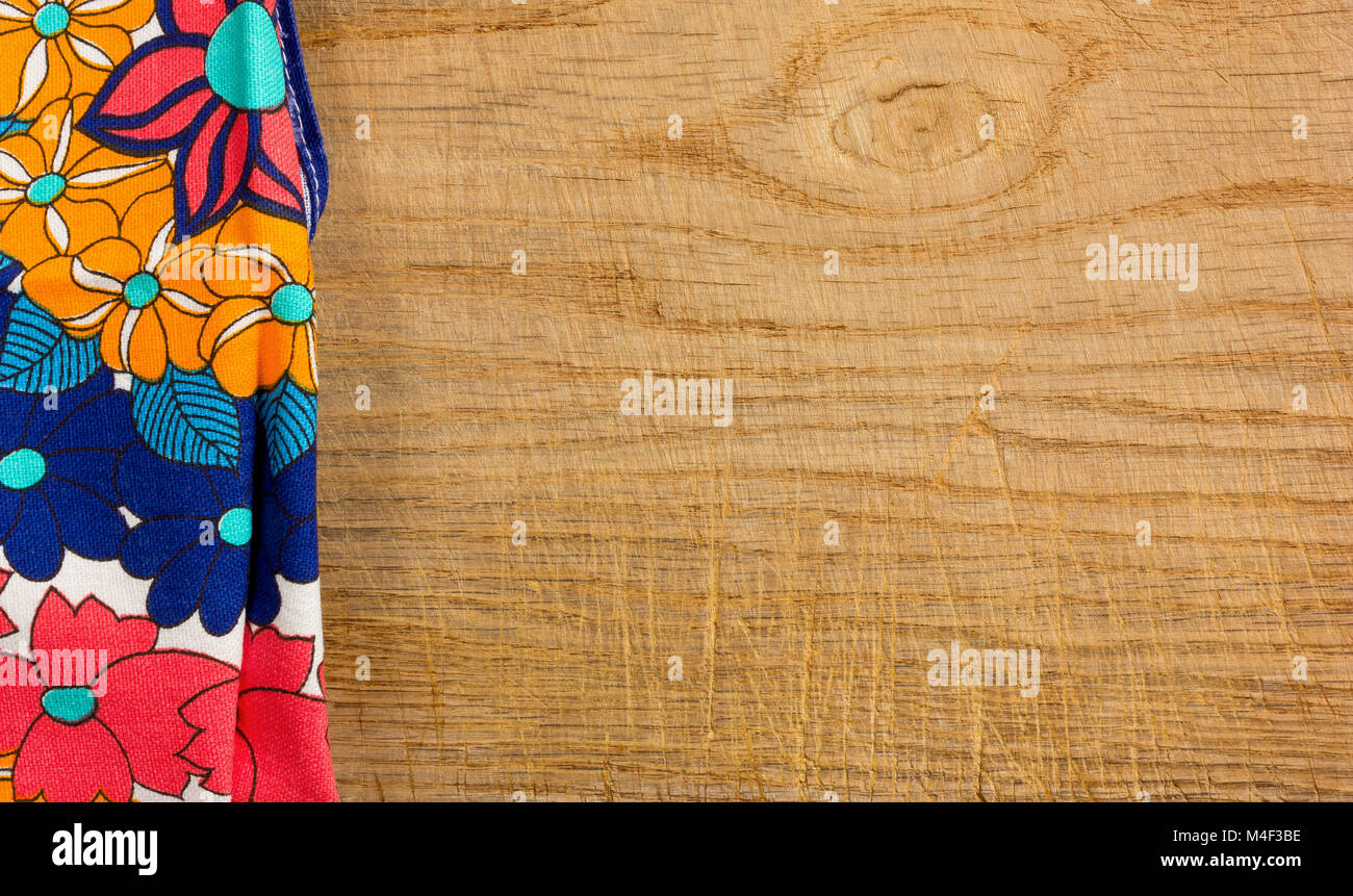 Decorated cloth placed on the left side of an old wooden background Stock Photo