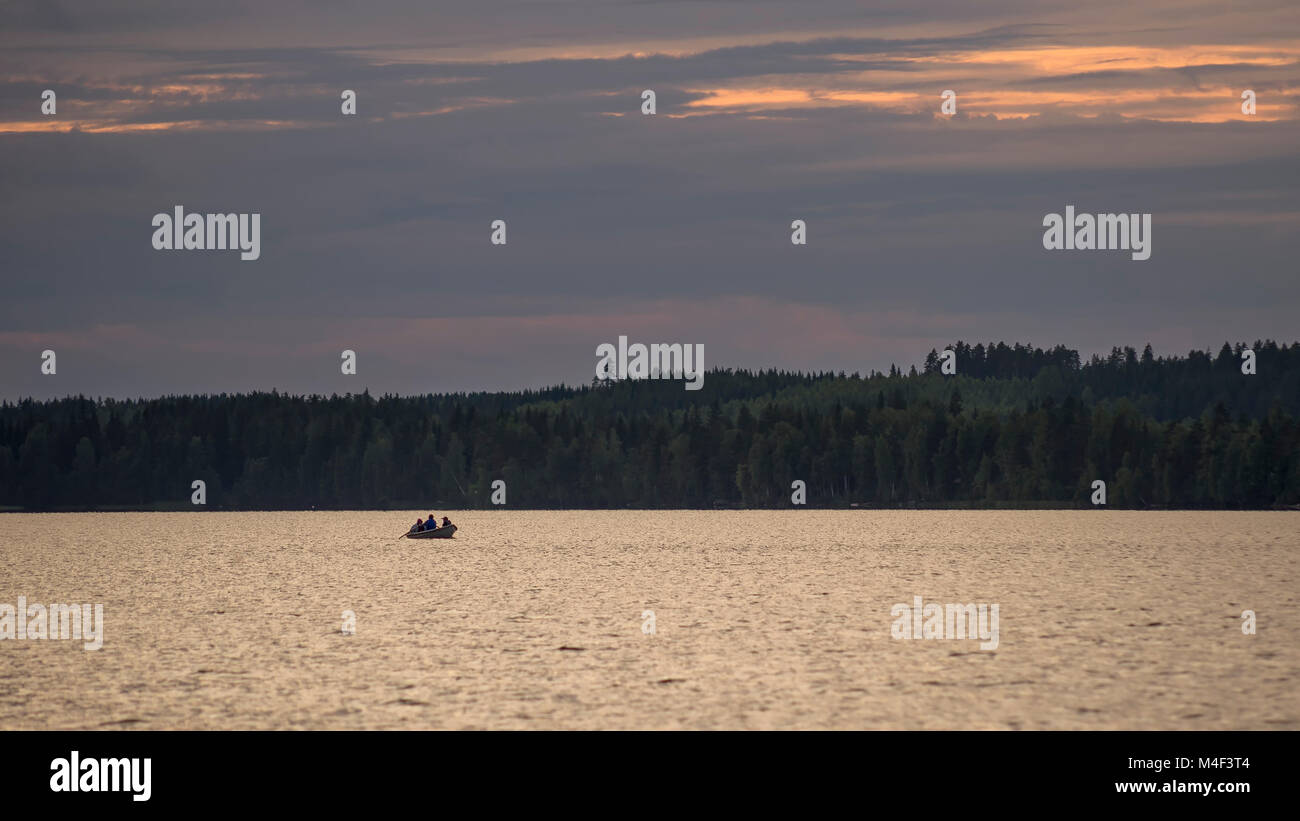Rowing boat at sunset, Rantasalmi, Finland Stock Photo