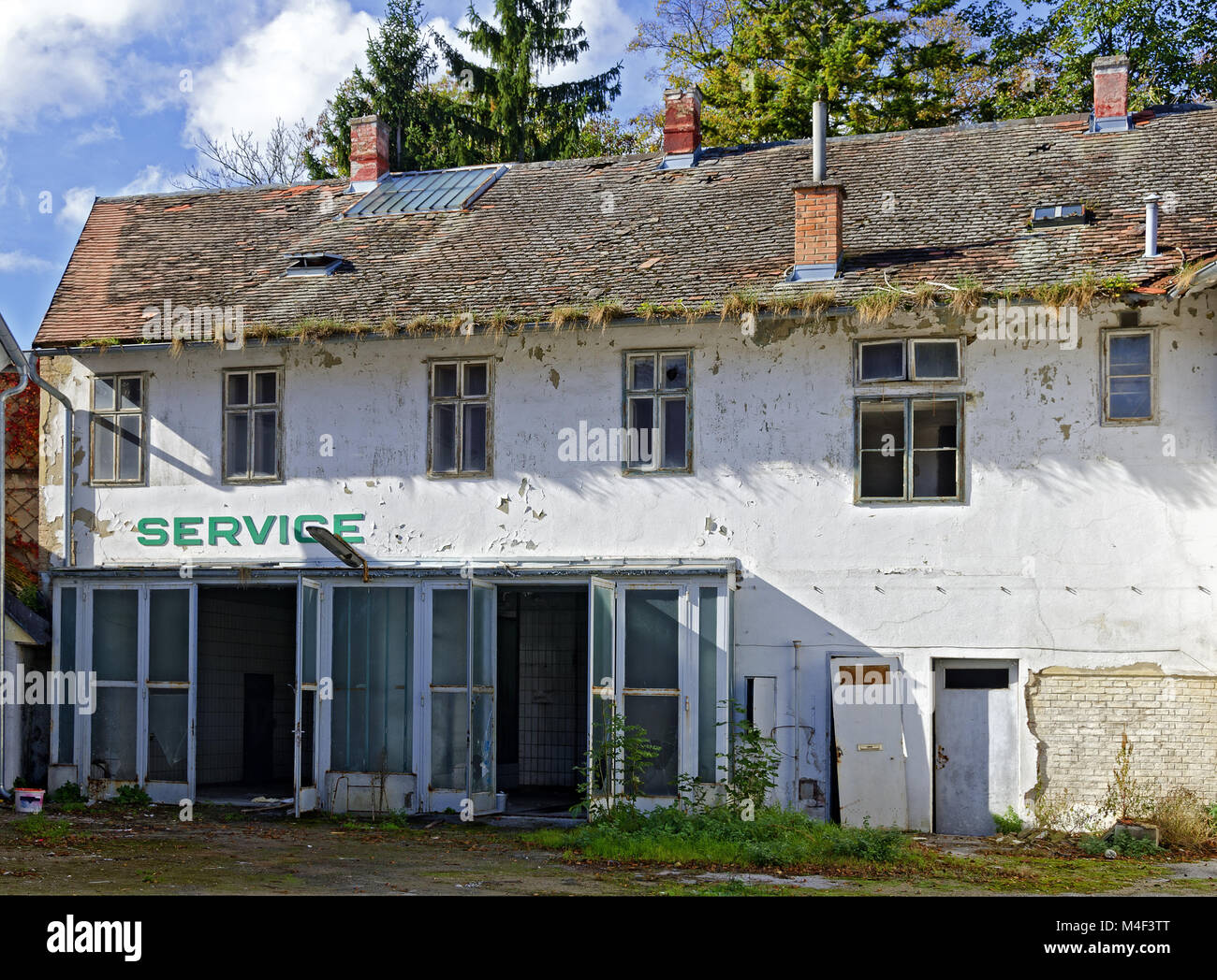 desolate former car service station Stock Photo