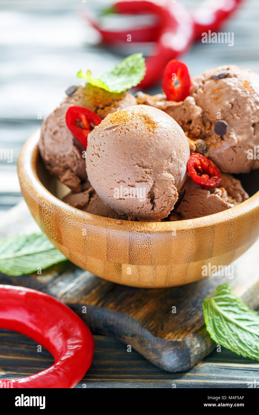 Bowl with chocolate ice cream and chili pepper Stock Photo Alamy