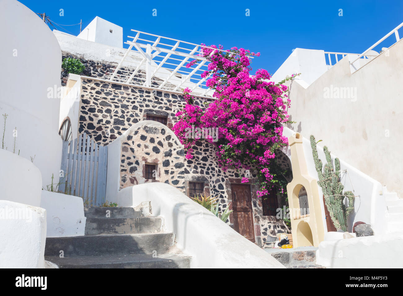 Traditional Greek whitewashed stone house, Santorini island, Greece. Stock Photo