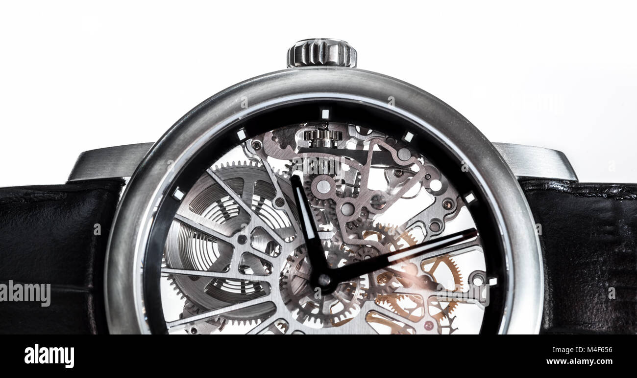 Elegant watch with visible mechanism, clockwork close-up. Stock Photo