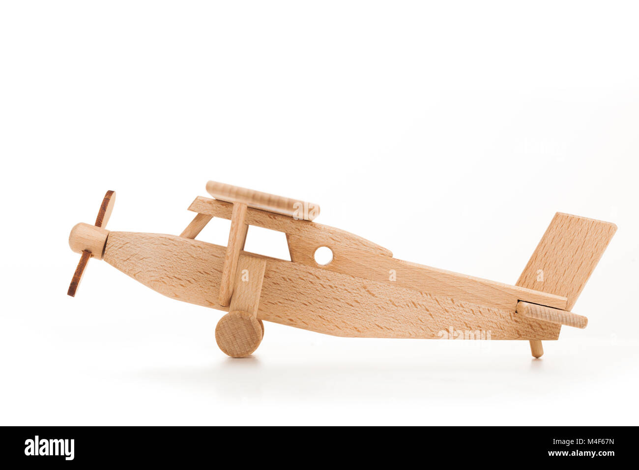 Retro wooden airplane isolated on white background Stock Photo