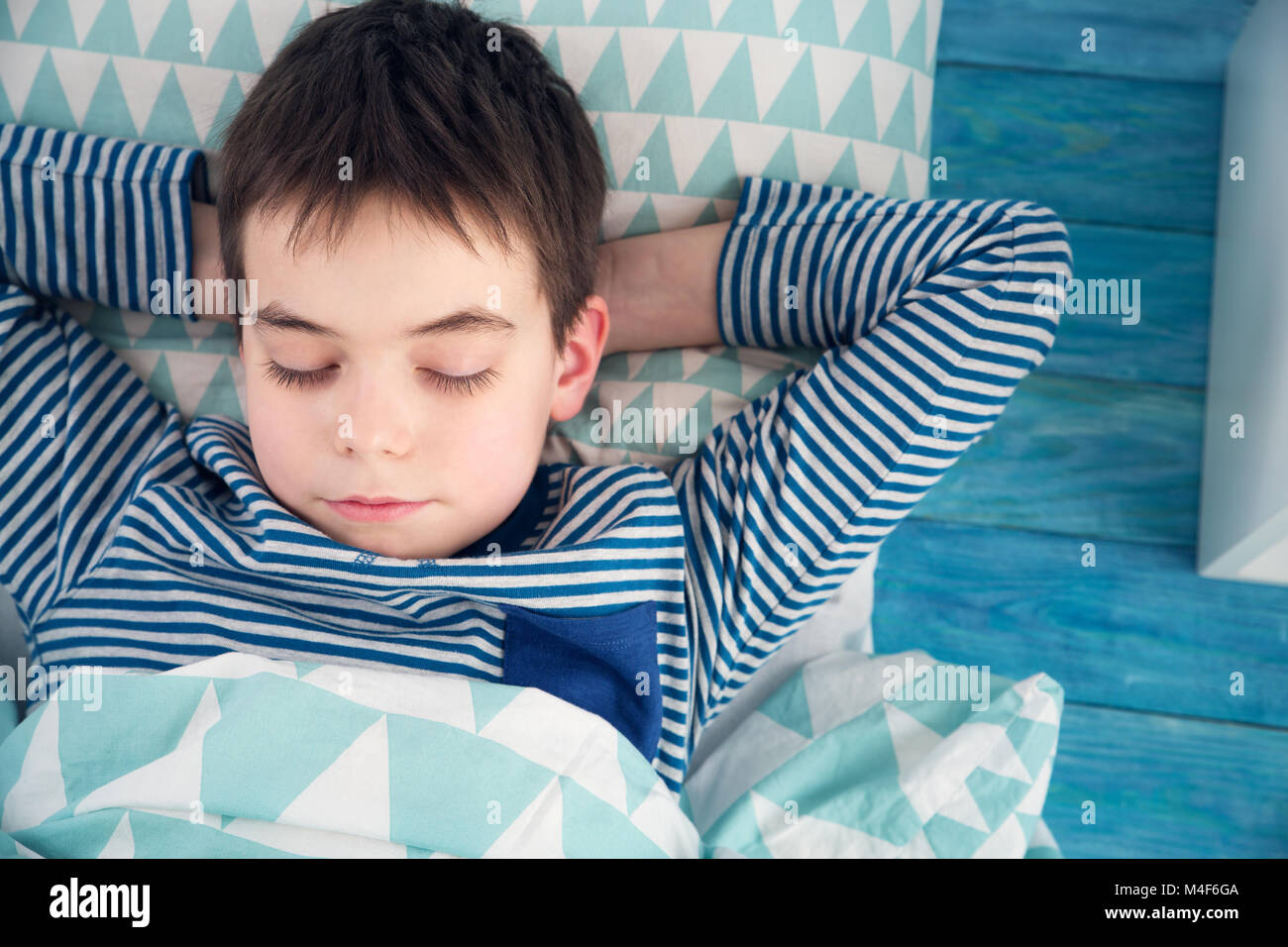eight years old child sleeping in bed on pillow Stock Photo Alamy