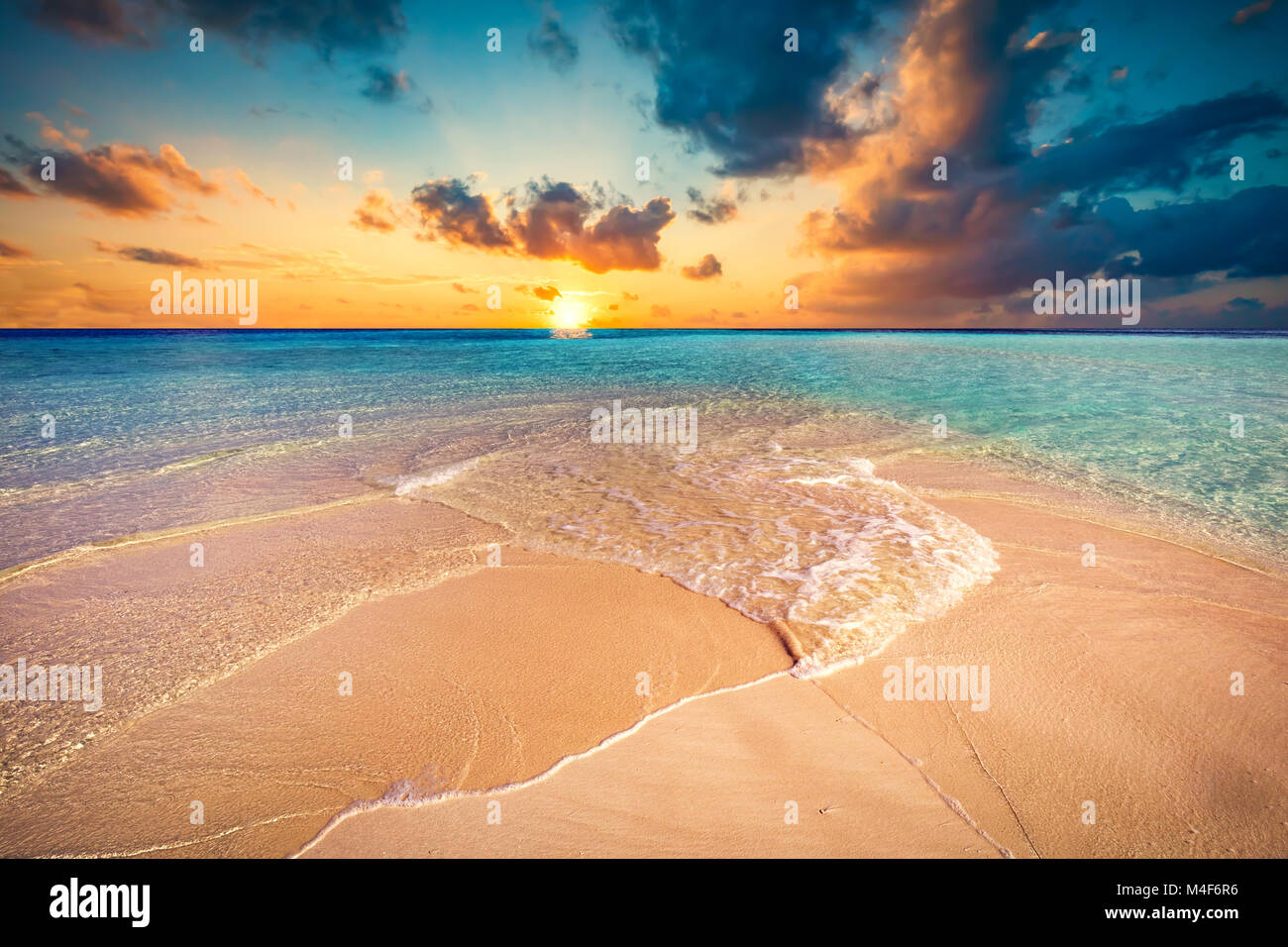 Tropical beach with white sand and clear turquoise ocean. Maldives Stock Photo