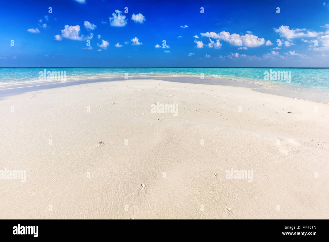 Tropical beach with white sand and clear turquoise ocean. Maldives Stock Photo