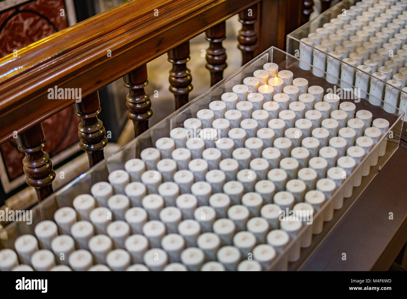 Electric candles inside church, modern religion Stock Photo Alamy