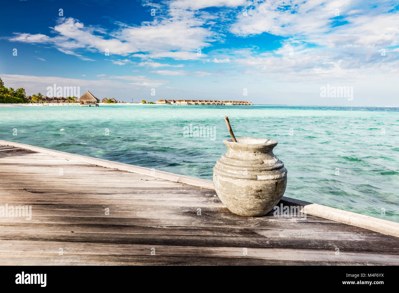 Wooden jetty towards a small island in Maldives Stock Photo