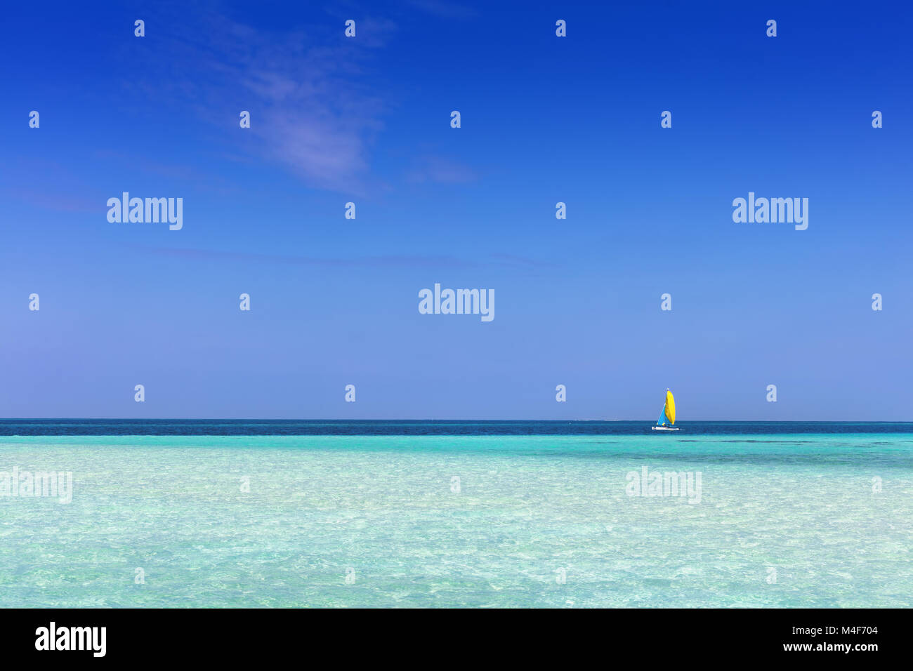 Tropical beach with white sand and clear turquoise ocean. Maldives Stock Photo