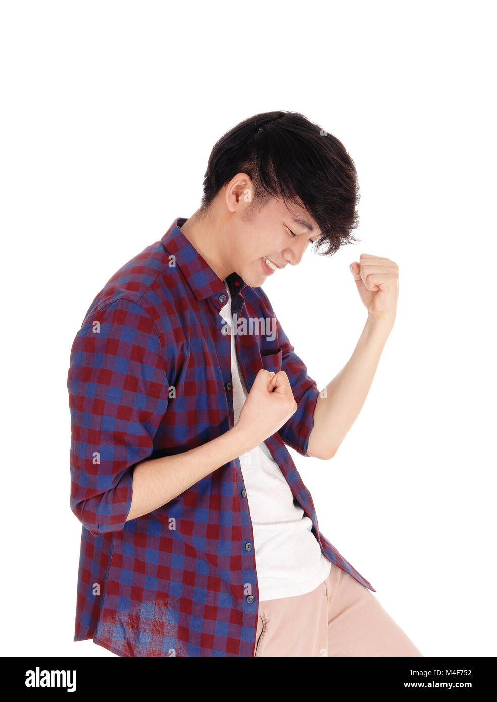 Happy Asian man in checkered shirt. Stock Photo