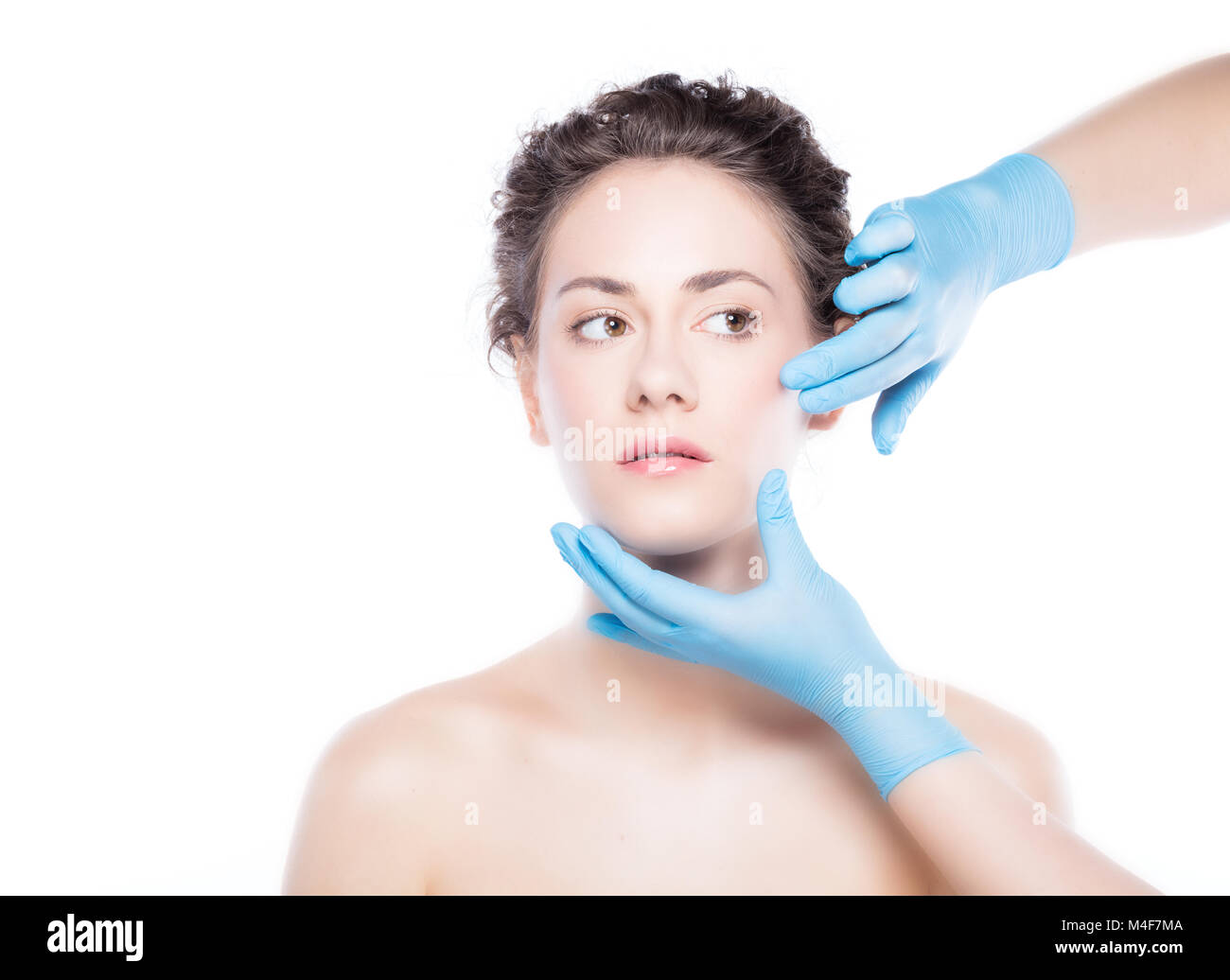 Young beautiful woman's skin review before treatment. Stock Photo