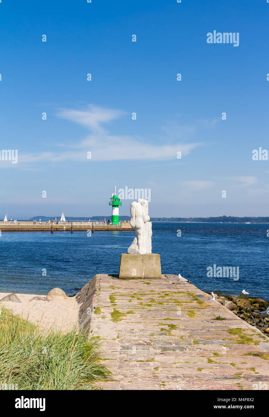 Lighthouse and port entrance at the Nordermole in Travemuende Stock Photo