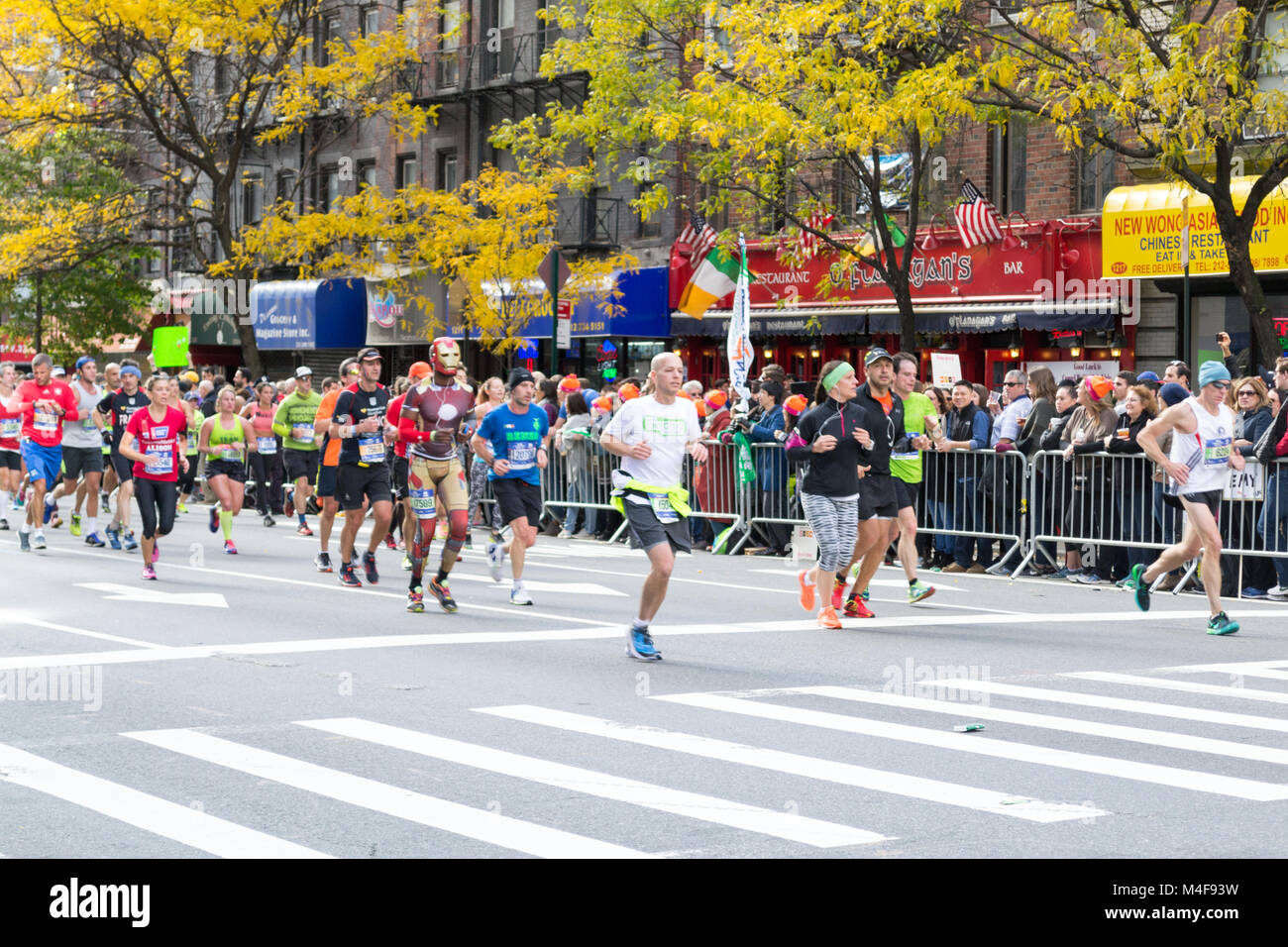 Marathon runners along first avenue in the NYC marathon 2016 Stock