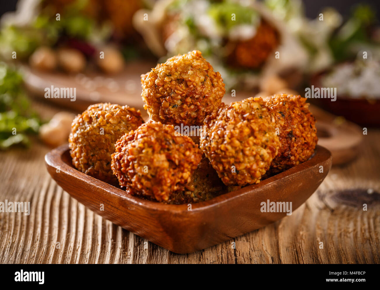Close up shot of falafel balls in wooden bowl Stock Photo