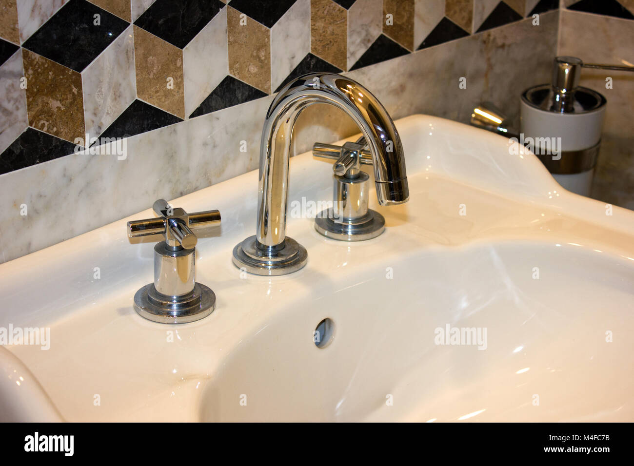 Shiny Clean Sink And Faucet In The Marble Room Stock Photo
