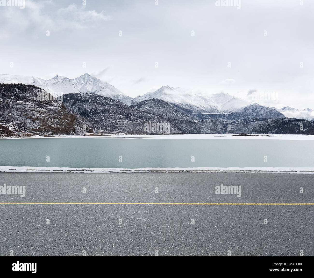 asphalt road and snow lake Stock Photo - Alamy