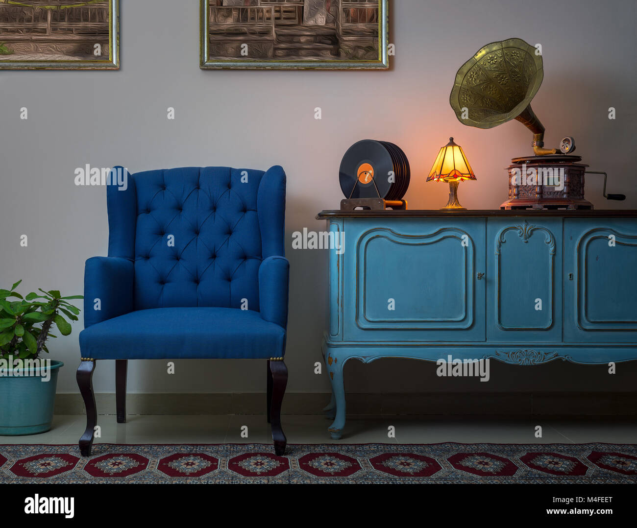 Interior Shot Of Blue Armchair Vintage Wooden Light Blue Sideboard Lighted Antique Table Lamp Old Phonograph Gramophone Vinyl Records Stock Photo Alamy