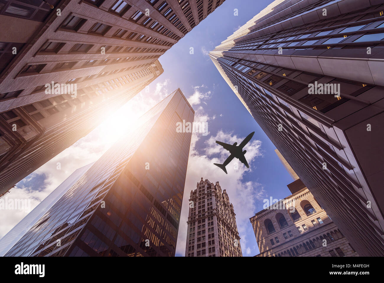 plane over skyskrapers Stock Photo