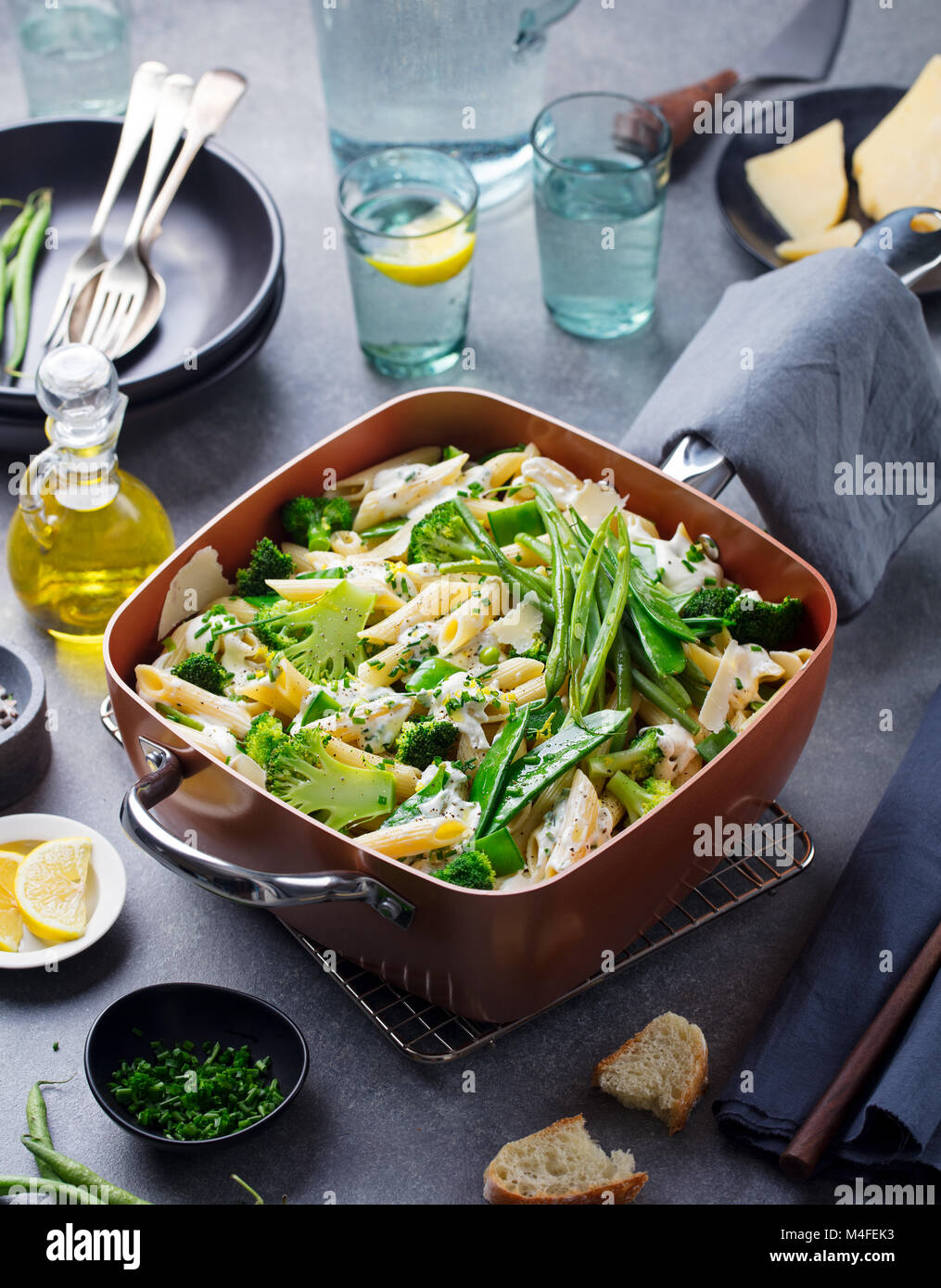 Pasta with green vegetables and creamy sauce Stock Photo Alamy
