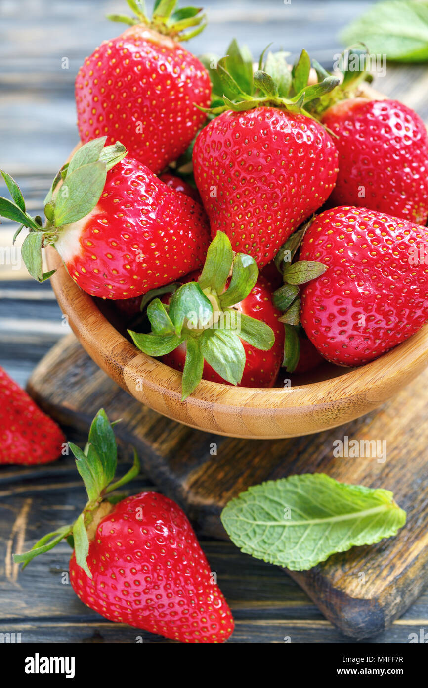 Ripe strawberry in a wooden bowl Stock Photo - Alamy
