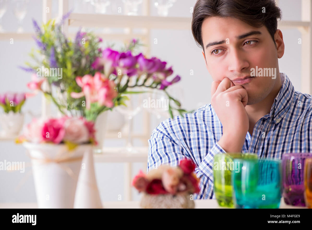 Young handsome man shopping in shop Stock Photo - Alamy