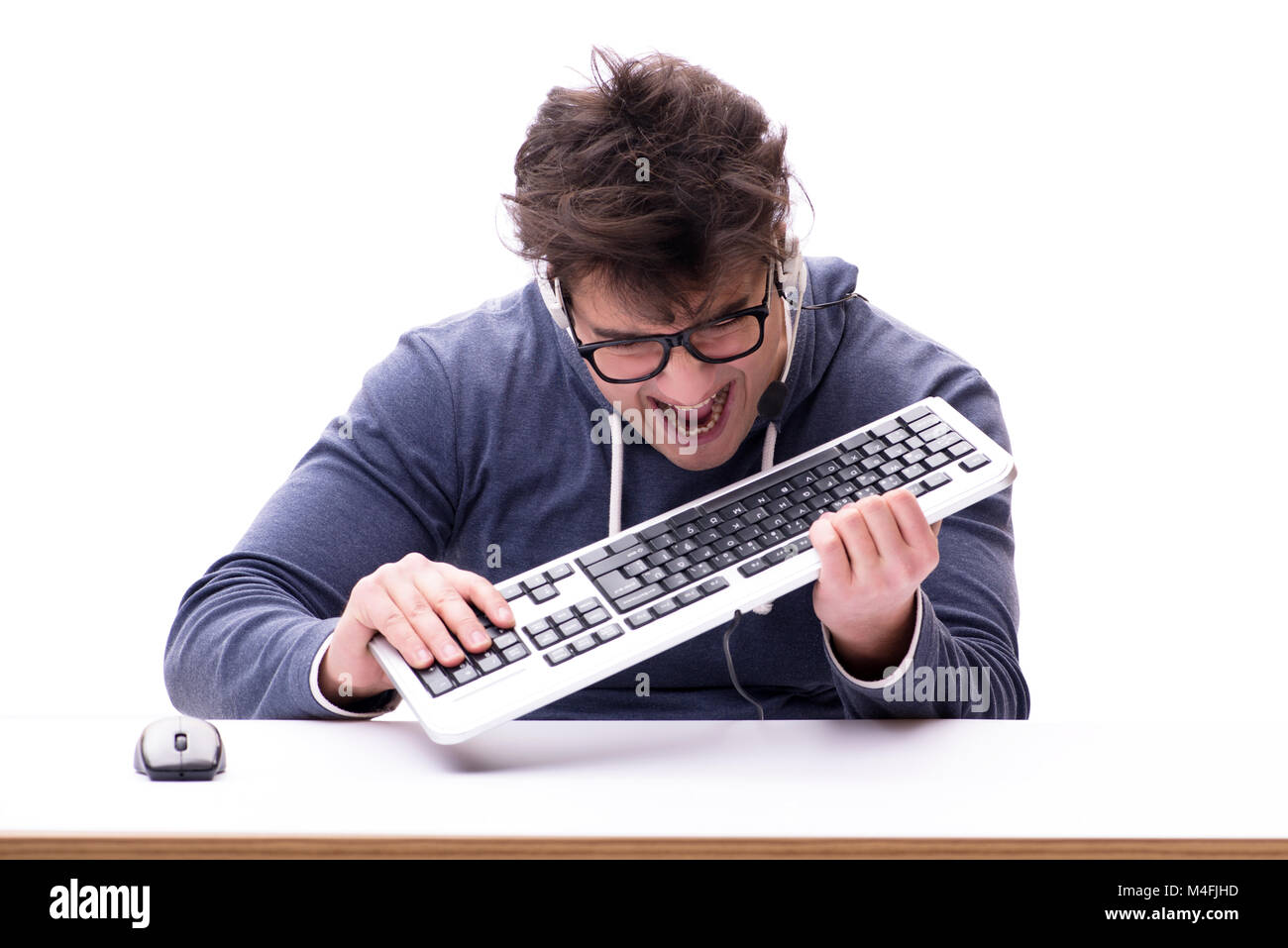 Funny nerd man working on computer isolated on white Stock Photo