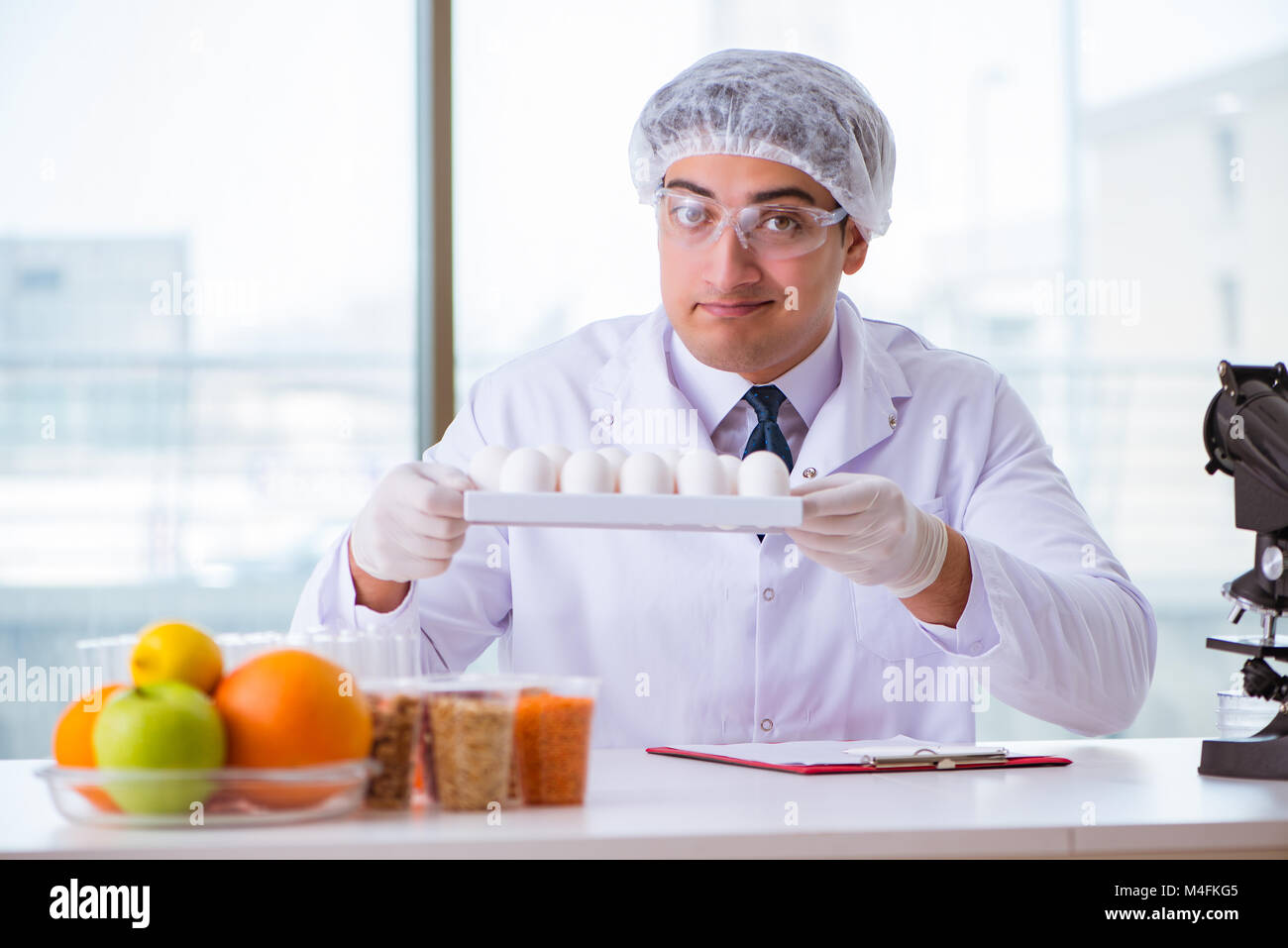 Nutrition expert testing food products in lab Stock Photo Alamy