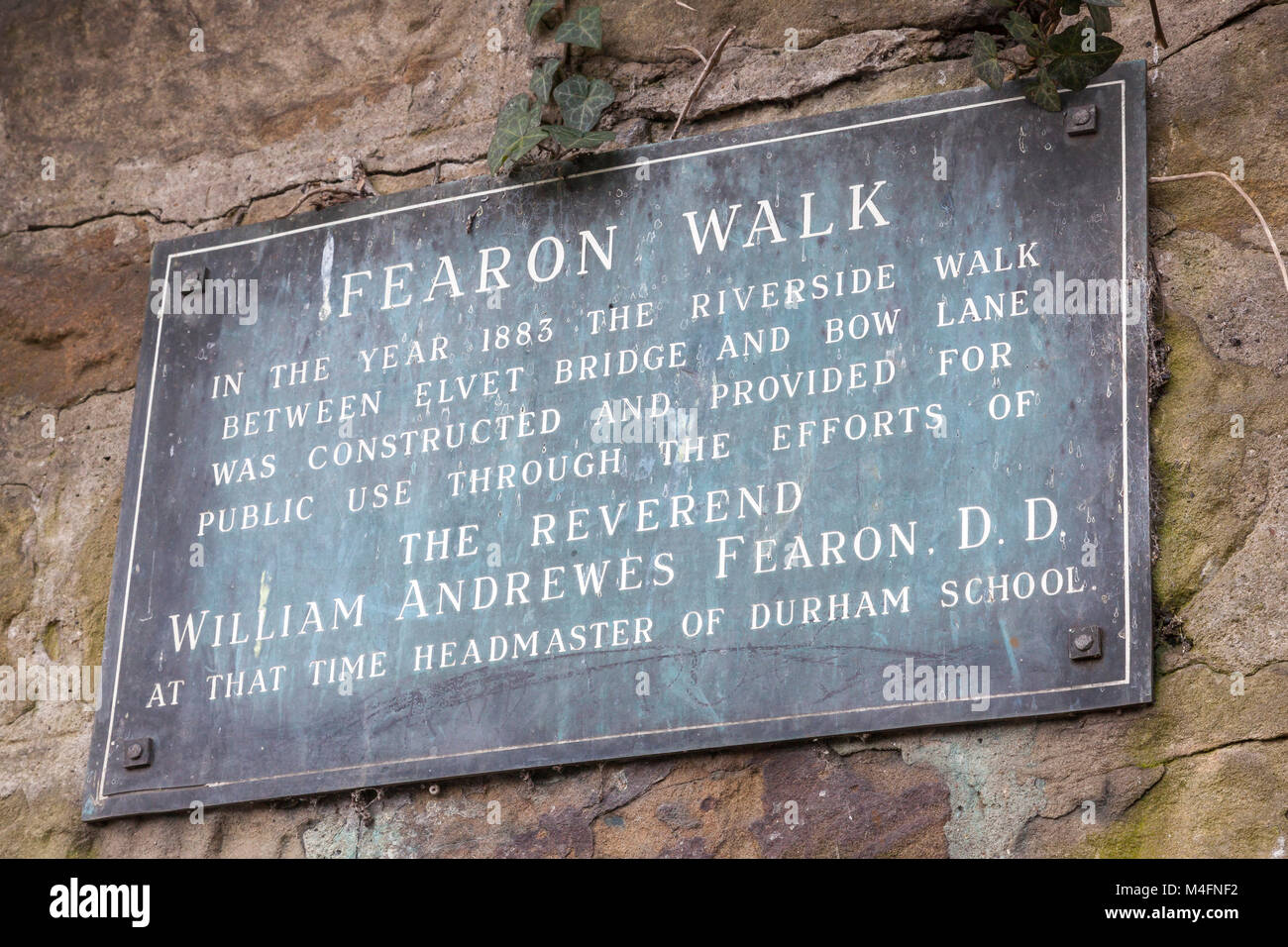 Plaque on a riverside wall in Durham describing the origins of Fearon Walk in 1883, County Durham, UK Stock Photo