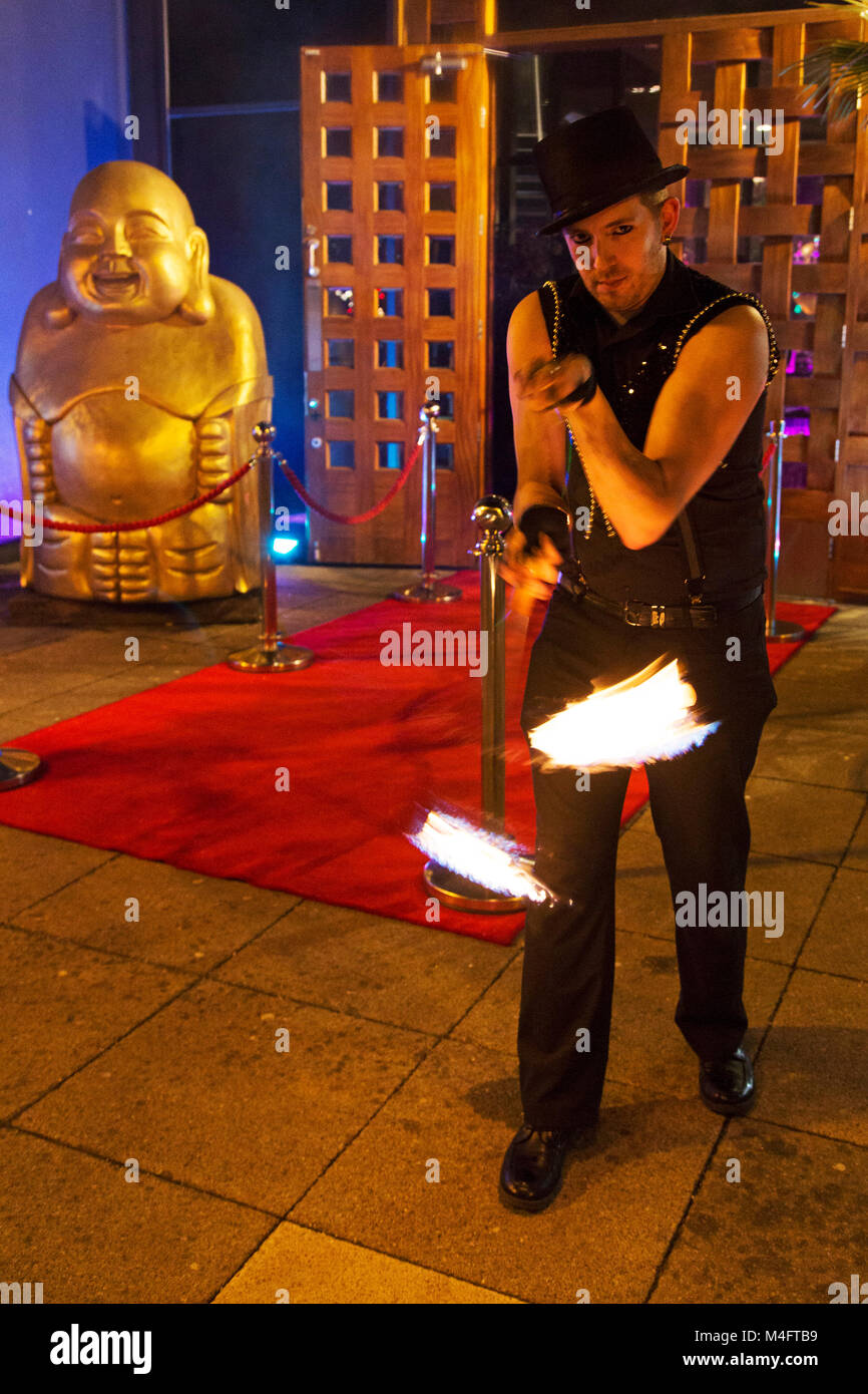 Newcastle, UK. 15th Feb, 2018. Entertainment outside of a VIP party at the Fat Buddha bar and restaurant in Newcastle-upon-Tyne, England. Ignite Entertainment dance with fire on a night that plans are announced to open Antler, an Alpine-style bar and restaurant, on the ground floor of the Fat Buddha premises in central Newcastle. Credit: Stuart Forster/Alamy Live News Stock Photo
