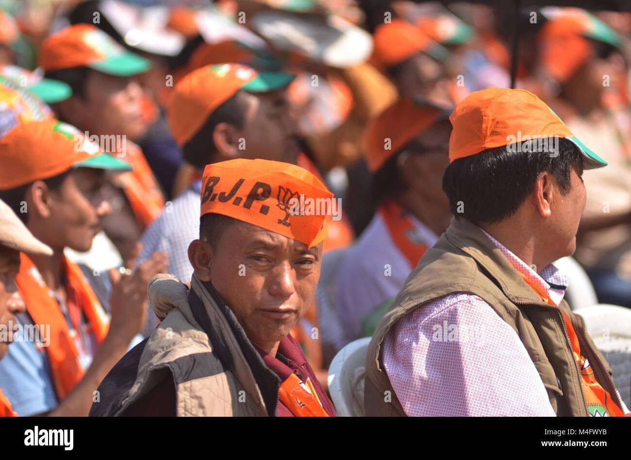 Dimapur, Nagaland, India. Feb 16th, 2018: Supporters of Bharatiya Janata  Party (BJP) at an election rally for Bharatiya Janata Party (BJP) ahead of  Nagaland, India. legeslative assembly election at Chumukidima in Dimapur,